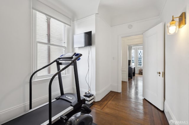 exercise area with dark wood-type flooring