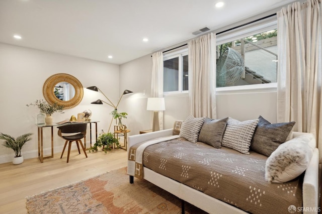 bedroom with hardwood / wood-style floors