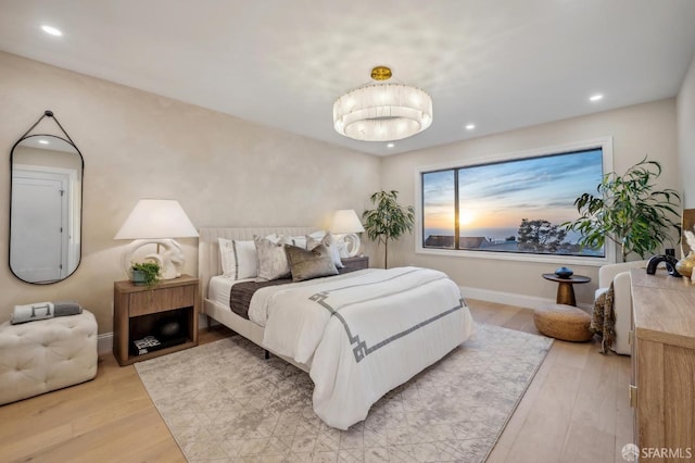 bedroom with light hardwood / wood-style floors