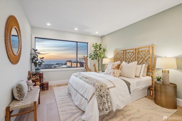 bedroom with light hardwood / wood-style flooring