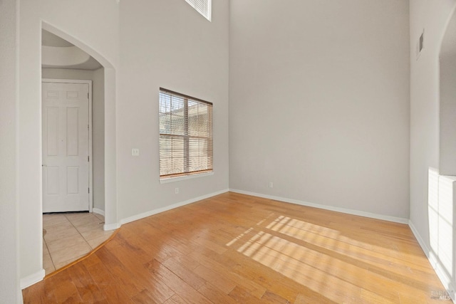 spare room with hardwood / wood-style floors