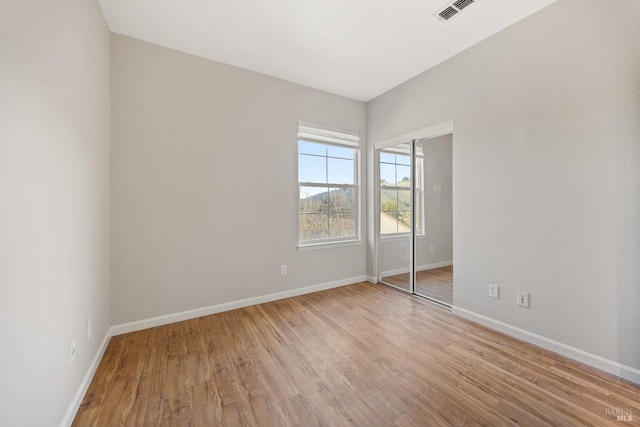 empty room with light wood-type flooring