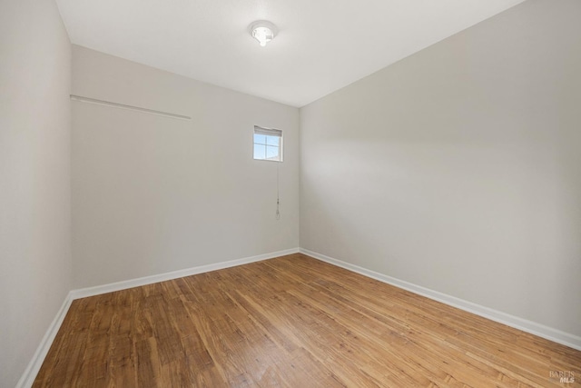 unfurnished room with hardwood / wood-style floors