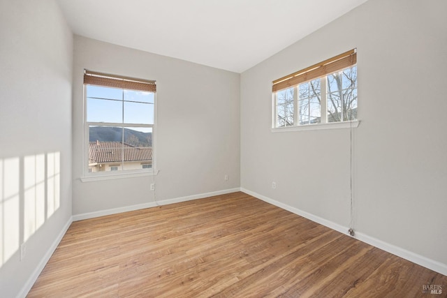 spare room with light wood-type flooring