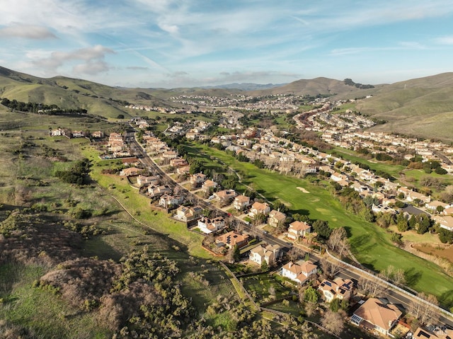 birds eye view of property with a mountain view