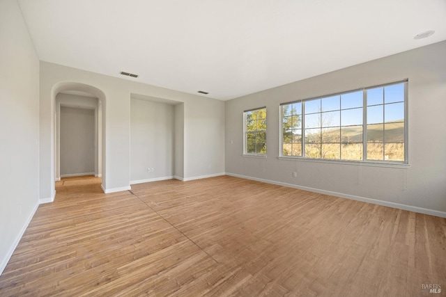 spare room featuring light wood-type flooring