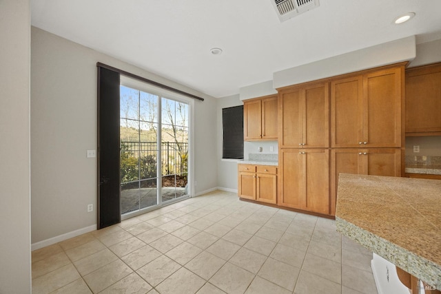 kitchen featuring light tile patterned flooring