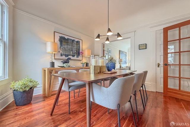 241 Lily St Unit B, San Francisco, CA 94102 - dining space featuring wood finished floors and ornamental molding