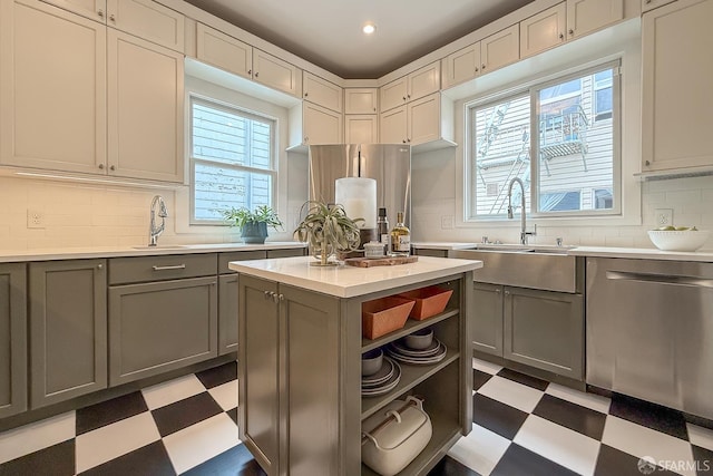 241 Lily St Unit B, San Francisco, CA 94102 - kitchen featuring light flooring, stainless steel appliances, gray cabinetry, open shelves, and light countertops
