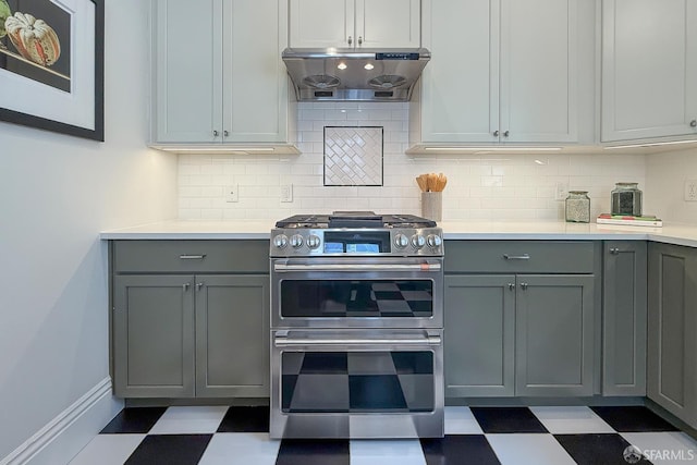 241 Lily St Unit B, San Francisco, CA 94102 - kitchen featuring double oven range, gray cabinets, tile patterned floors, and exhaust hood