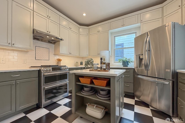 241 Lily St Unit B, San Francisco, CA 94102 - kitchen featuring stainless steel appliances, tile patterned floors, under cabinet range hood, open shelves, and gray cabinets