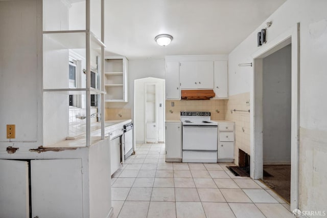 4770 Tompkins Ave, Oakland, CA 94619 - kitchen with electric range, under cabinet range hood, white cabinetry, light countertops, and decorative backsplash