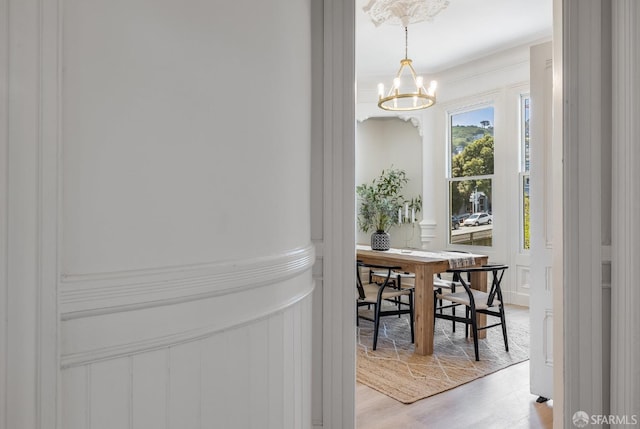 152-154 Ord St, San Francisco, CA 94114 - dining area featuring a chandelier, a decorative wall, and light wood-style floors