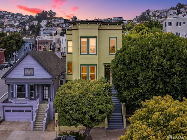152-154 Ord St, San Francisco, CA 94114 - view of front of house featuring stairway, a garage, and concrete driveway