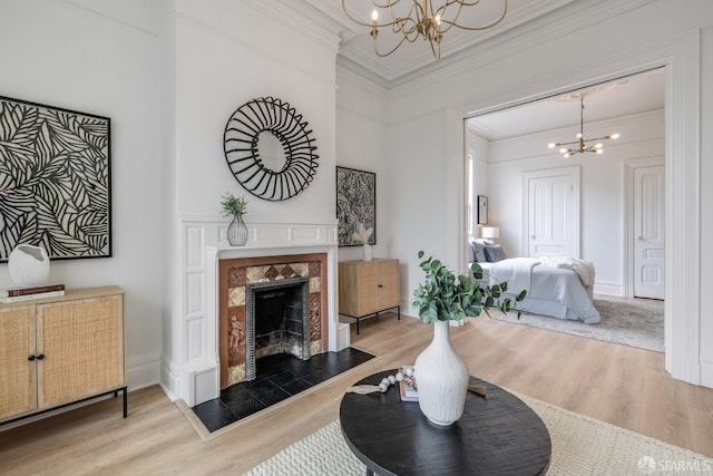 152-154 Ord St, San Francisco, CA 94114 - living room with a chandelier, wood finished floors, crown molding, and a tiled fireplace