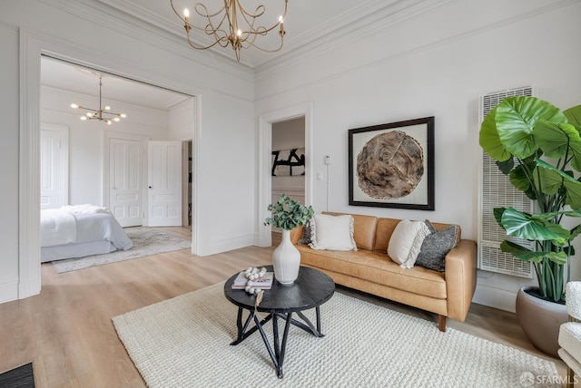 152-154 Ord St, San Francisco, CA 94114 - living room with a chandelier, light wood finished floors, ornamental molding, and baseboards