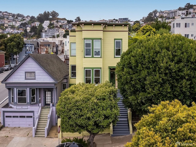 152-154 Ord St, San Francisco, CA 94114 - multi unit property with stairs, an attached garage, a residential view, and concrete driveway