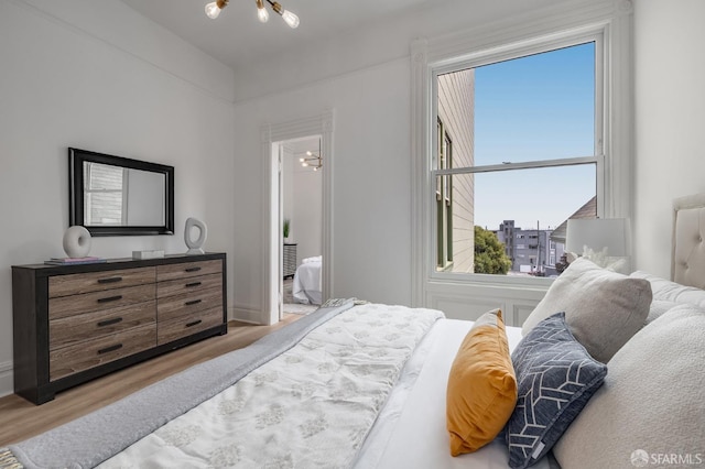 152-154 Ord St, San Francisco, CA 94114 - bedroom with wood finished floors and a chandelier