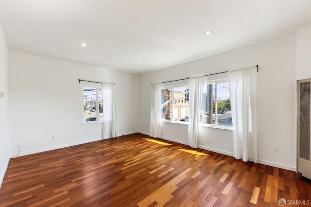 906 40th St, Oakland, CA 94608 - empty room with wood finished floors, recessed lighting, and baseboards