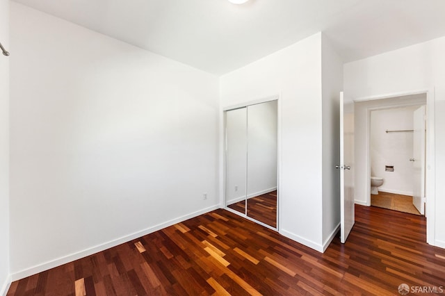 906 40th St, Oakland, CA 94608 - unfurnished bedroom with wood finished floors, a closet, and baseboards