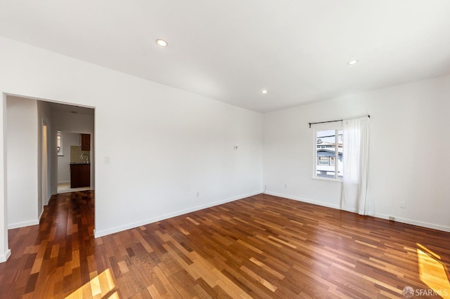 906 40th St, Oakland, CA 94608 - empty room with wood finished floors, baseboards, and recessed lighting