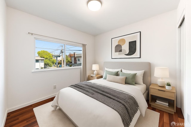 906 40th St, Oakland, CA 94608 - bedroom featuring dark wood-type flooring and baseboards