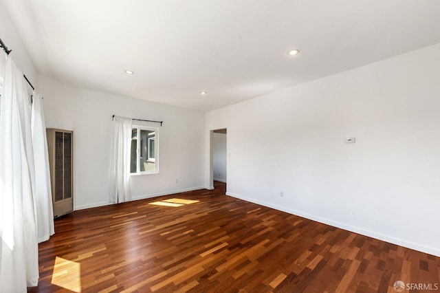 906 40th St, Oakland, CA 94608 - unfurnished bedroom featuring wood finished floors, a heating unit, baseboards, and recessed lighting
