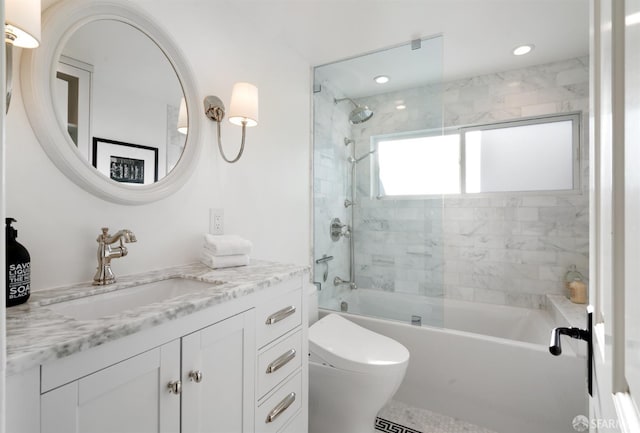 bathroom with recessed lighting, bathtub / shower combination, vanity, and toilet