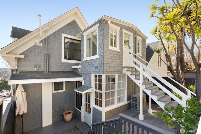 rear view of house with stairs