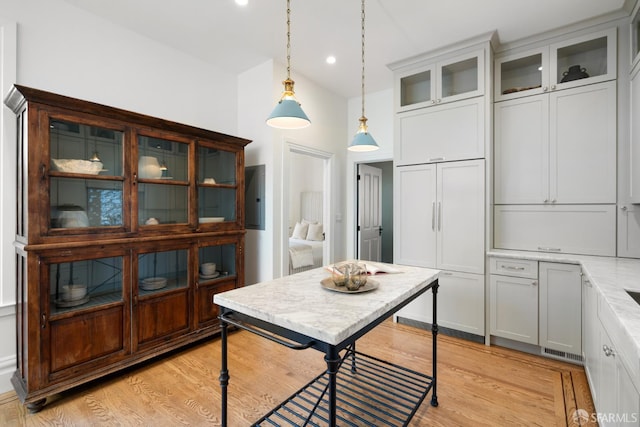 dining space with recessed lighting and light wood-style flooring