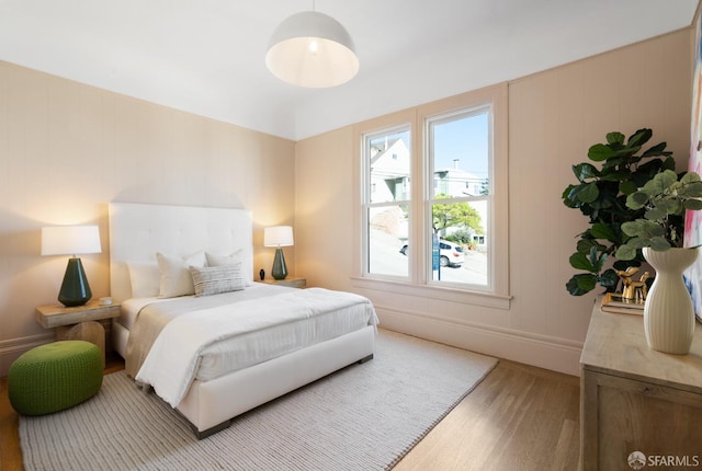 bedroom with baseboards and light wood-style floors