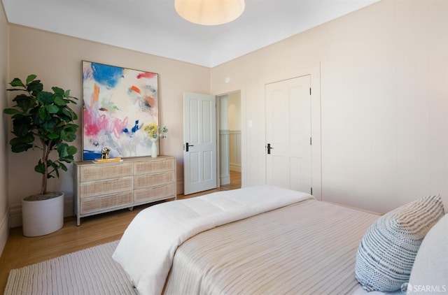 bedroom featuring wood finished floors