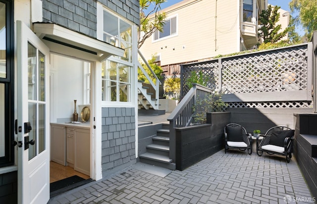 view of patio / terrace featuring stairway