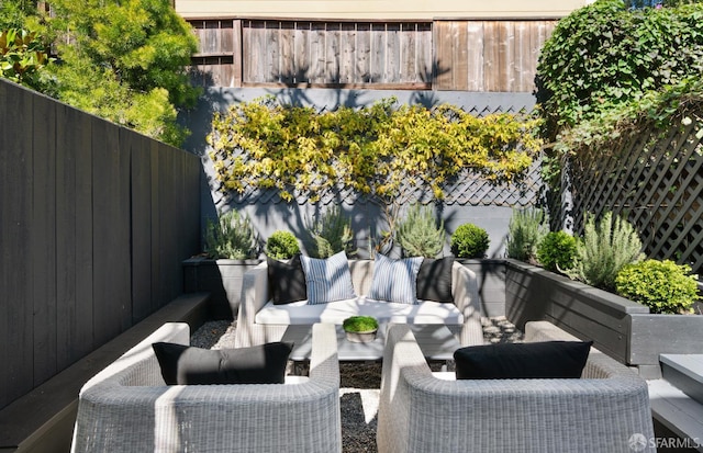 view of patio / terrace featuring fence and an outdoor living space