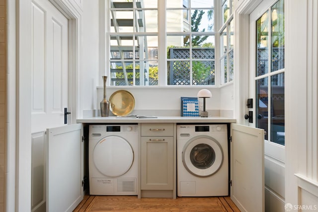 laundry room with laundry area and light wood-style flooring