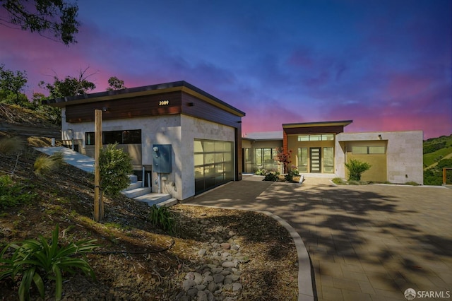 2009 Bishop Rd, Belmont, CA 94002 - contemporary house with an attached garage, stucco siding, and driveway