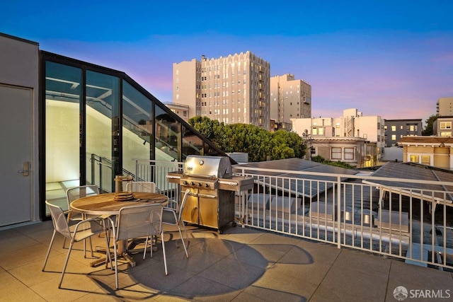 balcony at dusk with grilling area