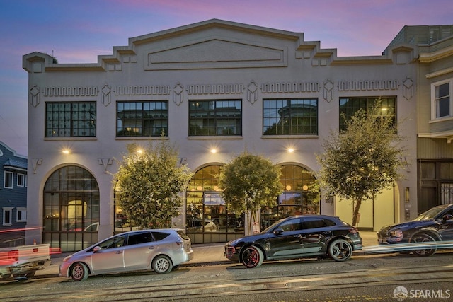 view of outdoor building at dusk