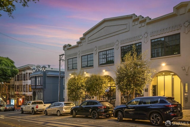 view of outdoor building at dusk