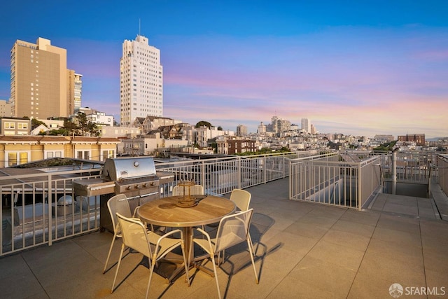 view of patio terrace at dusk