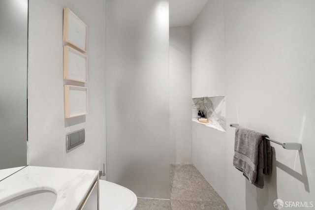 bathroom with vanity and toilet