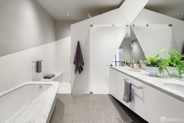 bathroom featuring a bathtub and vanity