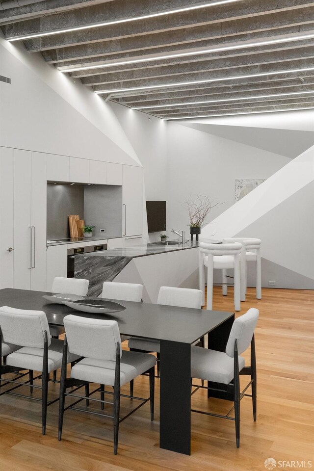 dining area with hardwood / wood-style flooring