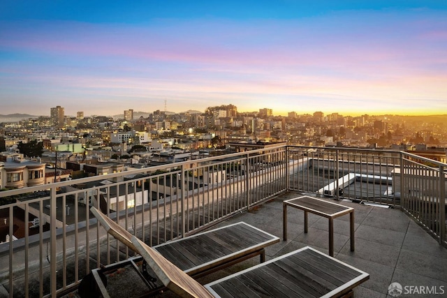 view of balcony at dusk