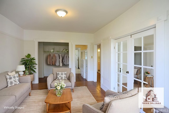 living room with french doors and hardwood / wood-style flooring