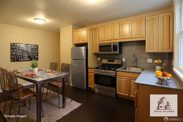 kitchen with appliances with stainless steel finishes, dark hardwood / wood-style flooring, sink, and light brown cabinets