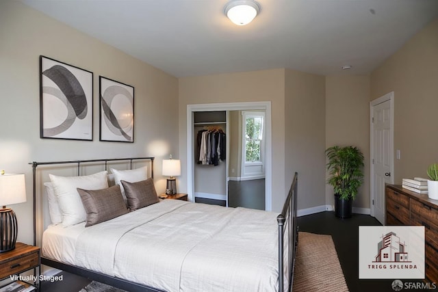 bedroom with dark wood-type flooring and a closet