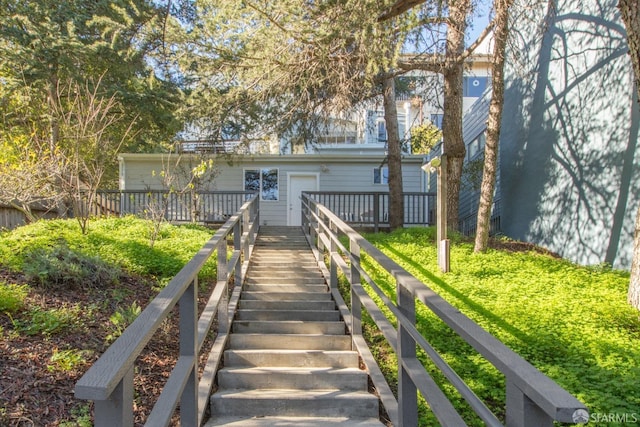 back of house with a wooden deck