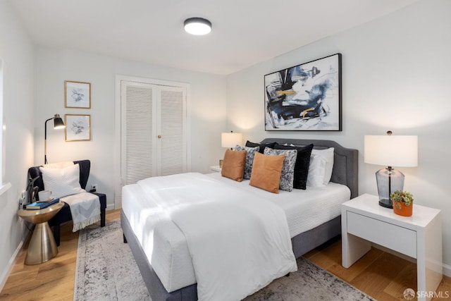 bedroom with a closet and light wood-type flooring