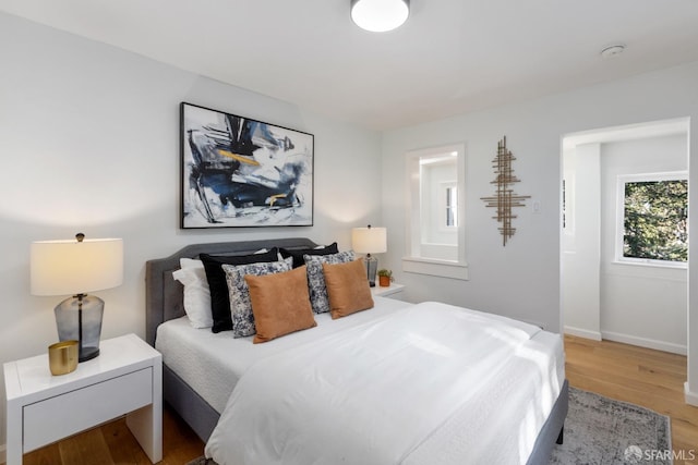 bedroom with wood-type flooring